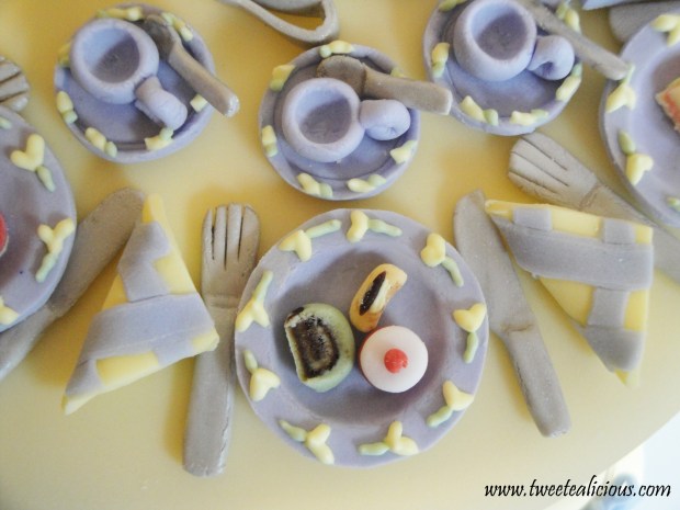 Plate setting with fork, knife, napkin, teacup set with spoon